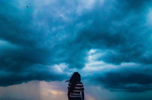 Woman facing oncoming storm