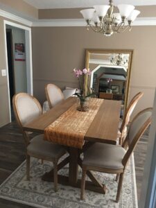 Trestle table,oversized mirror in minimalists dining room